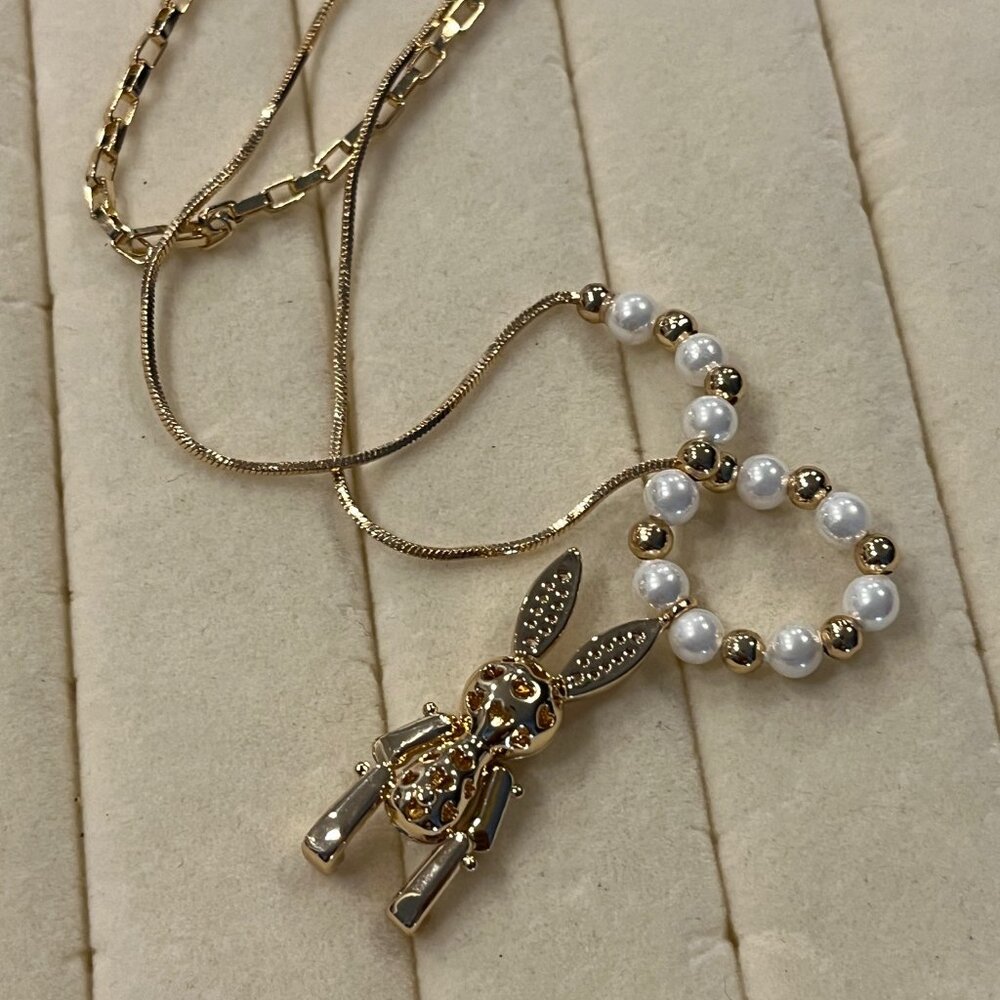 White Shell Pearl and Austrian Crystal Rabbit Necklace in Goldtone